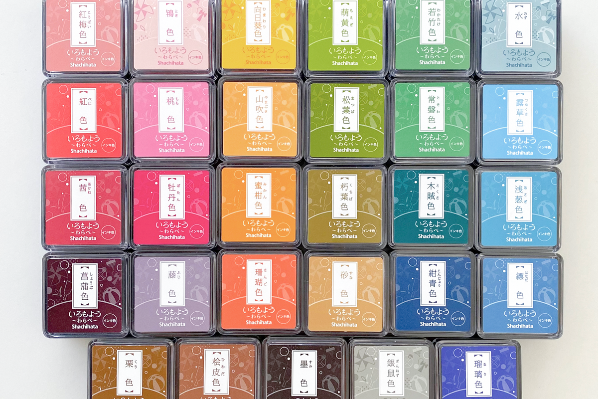 A grid of Shachihata color stamp pads in assorted Japanese ink shades, from the Ink collection