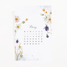 4×6 velvet journaling card with May 2025 floral calendar—pastel cosmos, daisies, bellflowers on soft background.