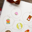 Fruit-label page inside the 2027 journal. Photo: OURS Studio