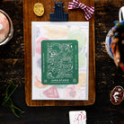 The postcards and little cards gift envelope that comes with the 2027 journal. Photo: OURS Studio