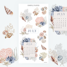 Coastal calendar kit cover—July journaling stickers with shells, coral, and soft ocean blues for summer-themed planners