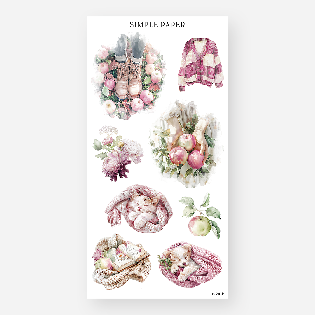 Sheet of decorative stickers featuring kittens and puppies wrapped in blankets, apples, flowers, and cozy autumn clothing on a white background
