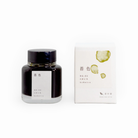 Tag Stationery Kyo No Oto Ink No. 3 Yellow Green Color Kokeiro, bottle with its box on a white background