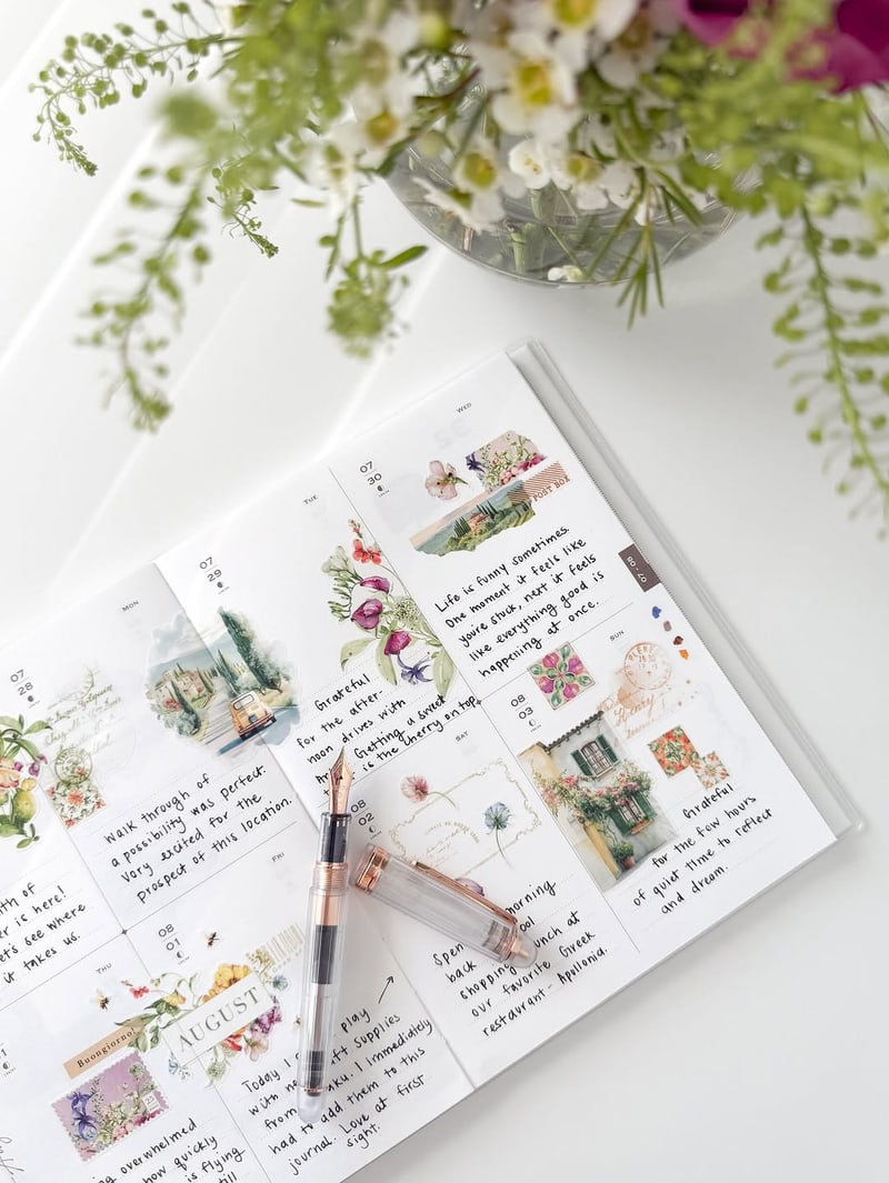 An open OURS research journal with handwriting and Letters from Tuscany stickers