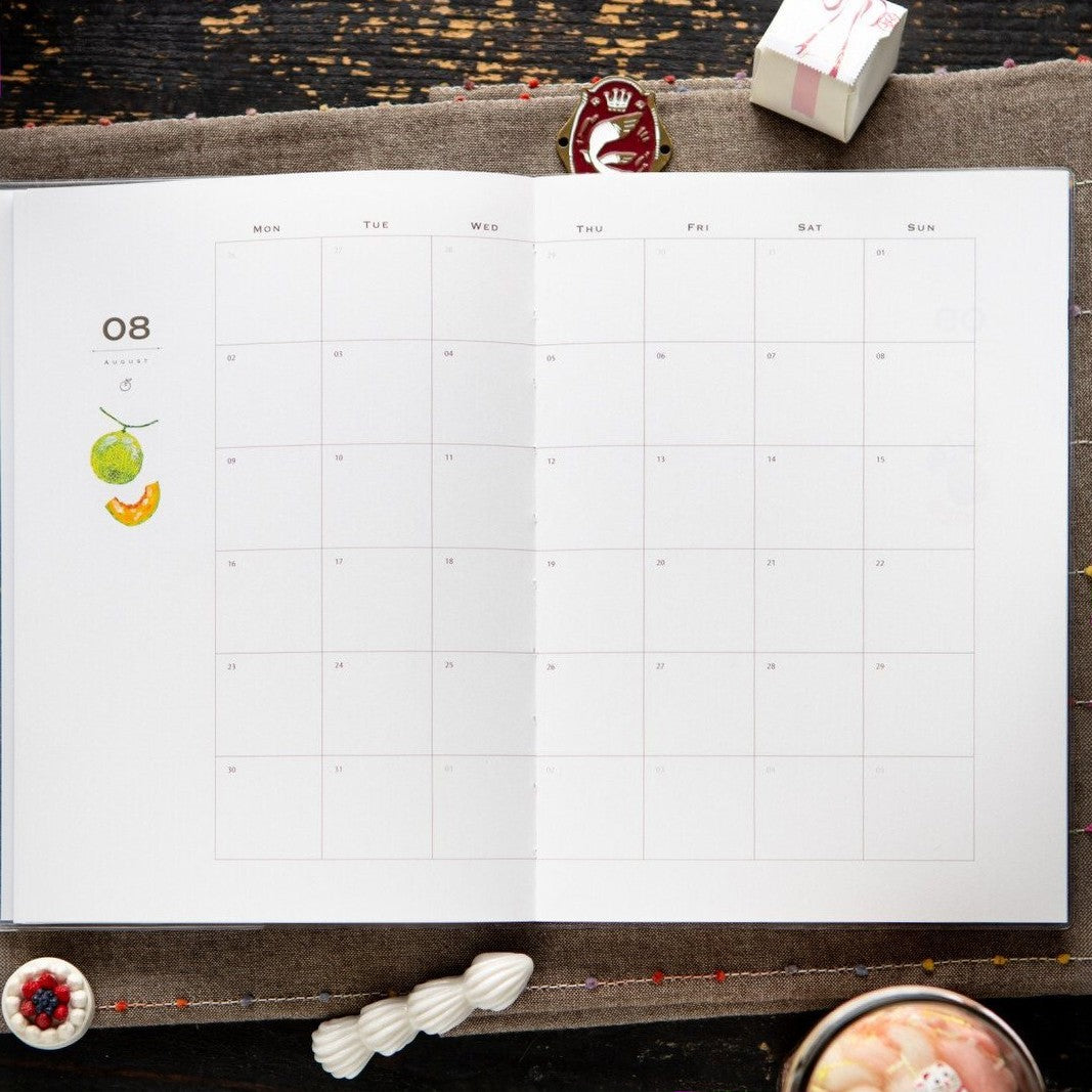 The month at a glance: the 2027 journal open to a monthly calendar spread. Photo: OURS Studio